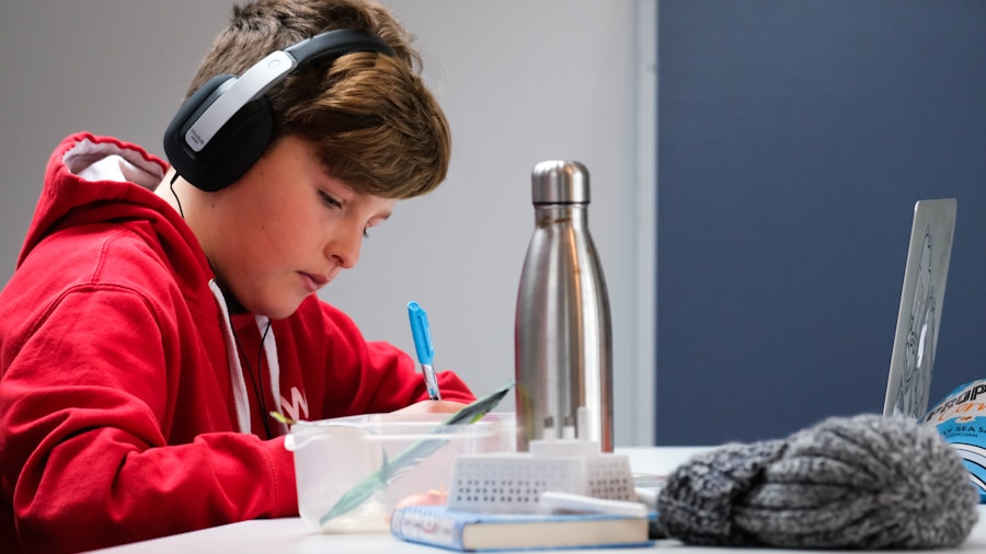 child wearing kids headphones studying