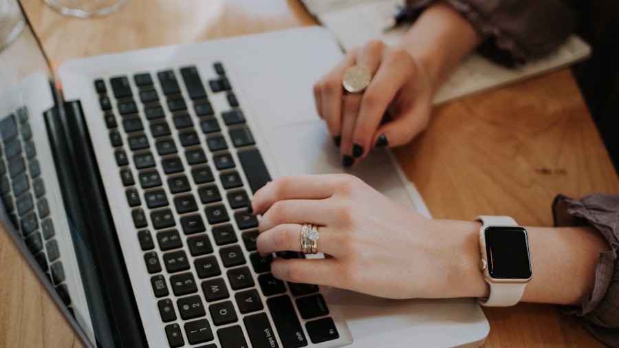 creative professional typing laptop pen