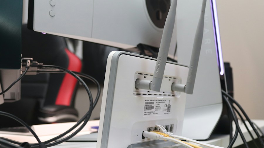 Devolo WiFi 7 Mesh System Launches with Dual Band Flexibility for US Shoppers 2 person setting up router connection