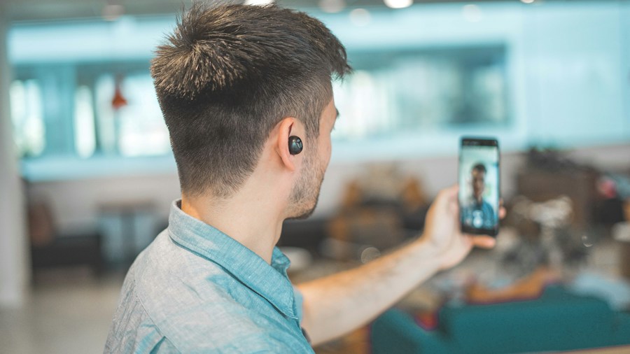 Bose QuietComfort Ultra 2nd Gen Gets Major Free Update: What Shoppers Need to Know 1 person using headphones for video call