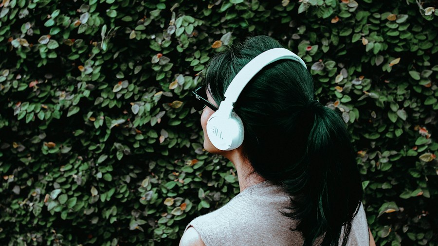 Technics Releases New Flagship Headphones Using Hi-Fi Speaker Technology: What Buyers Should Know 2 person wearing over-ear headphones outdoors